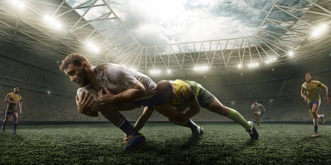 Rugby players fight for the ball on professional rugby stadium - obrazy, fototapety, plakaty