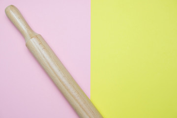Wooden Rolling-Pin On The Pastel Colors Background Light Pink And Yellow Minimal Style Top View Concept Of Kitchen And Cooking Paper Blank With Space For Text