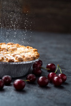 cherry pie with sprinkles powdered sugar.