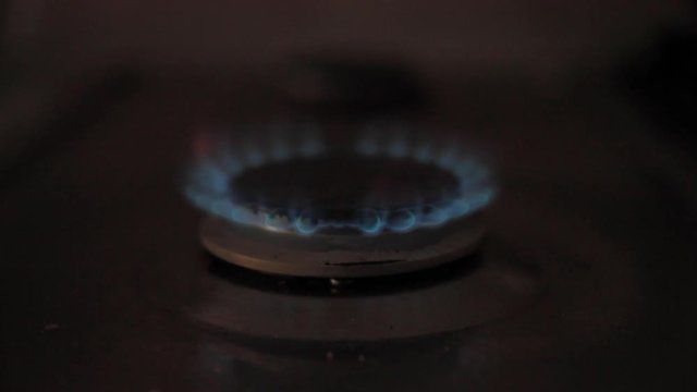 Ignition of the gas stove in the afternoon before cooking in slow motion