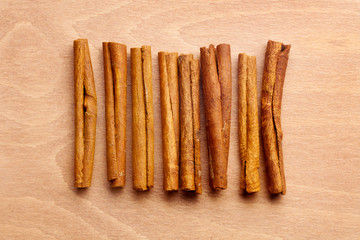 cinnamon sticks , isolated on wooden background