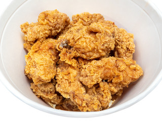 roasted spicy chicken wings close up in bucket