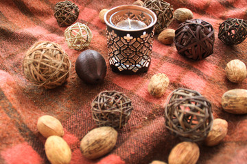 Autumn decor with candles on the background in a cage