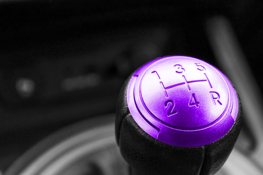 Abstract view of a gear lever, manual gearbox, car interior details. Black and white, red