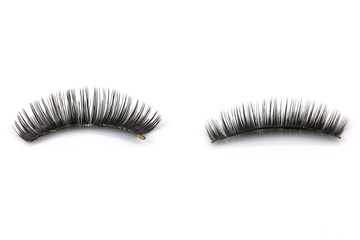 Black fake eyelashes used On a white background