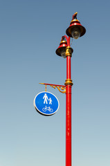 Fototapeta na wymiar Street lamp with a traffic sign for pedestrians. Kiev, august 2018