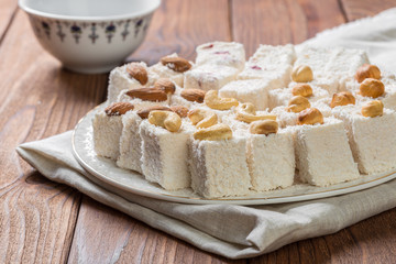 Turkish delight on a wooden table.