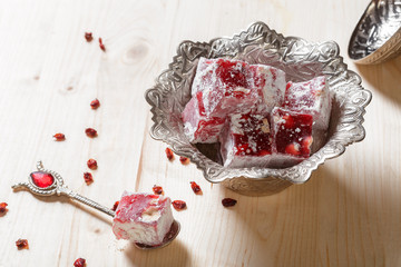 Turkish delight on a wooden table.