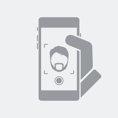 Bearded man takes a selfie