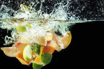 many fruits splashes into water