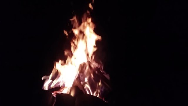 Slowmotion video of wood burning in the night