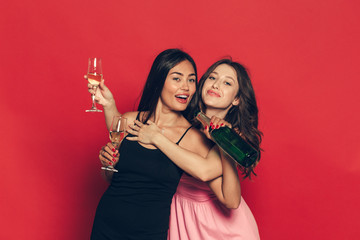 young womans with a champagne glasses at celebration