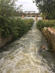Fototapeta premium water flowing from dam into river
