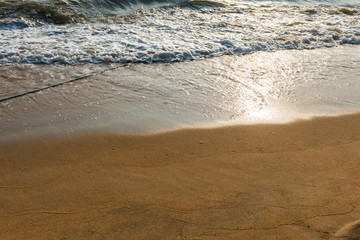 Waves washing sand