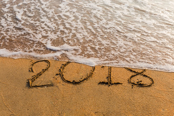 2018 on a beach sand