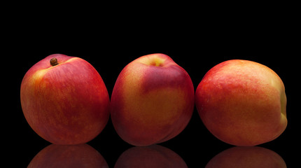 group of juicy peaches lying isolated