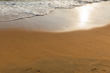 Wave of the sea on the sandy beach