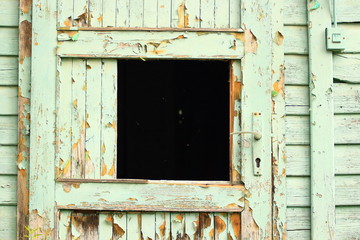 Old wooden door on abadoned house