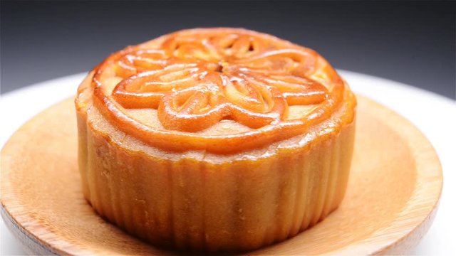 side view traditional style moon cake rotating close up