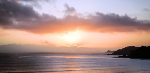 Pretty pink and purple sunrise over the Hauraki Gulf from Waiheke Island in New Zealand.