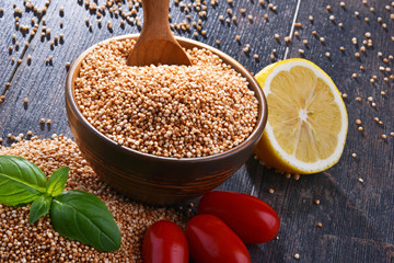 Bowl of amaranth grain on wooden table