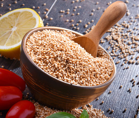 Bowl of amaranth grain on wooden table
