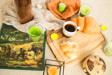 Flat lay composition with coffee and croissants.