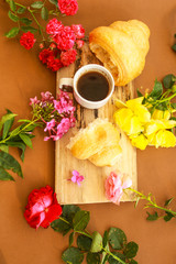 Flat lay composition with cup of coffee and croissants.
