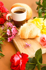 Flat lay composition with cup of coffee and croissants.