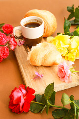 Flat lay composition with cup of coffee and croissants.