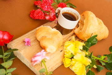 Flat lay composition with cup of coffee and croissants.