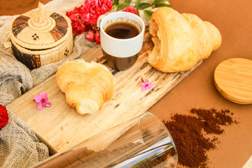 Flat lay composition with cup of coffee and croissants.