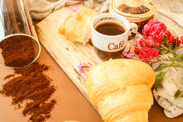 Flat lay composition with cup of coffee and croissants.