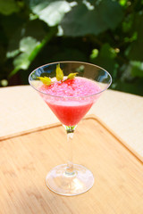 Photo of watermelon cocktails on wooden board.