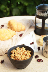 Morning flat lay with croissants,tea and granola.