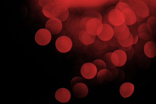 red bokeh on black festive background