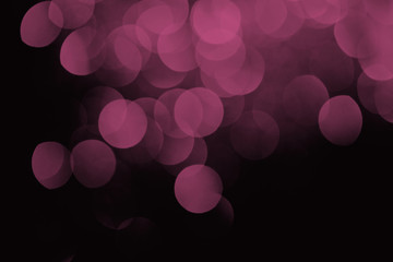 festive purple bokeh on black background