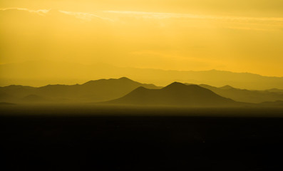 Silhouettes of mountains at sunset