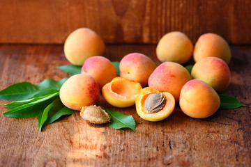 Ripe apricots on the old wooden background
