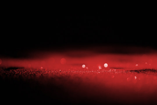 abstract shiny red glitter on dark background