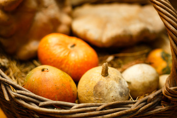 Pumpkin and autumn leaves on a old wooden table