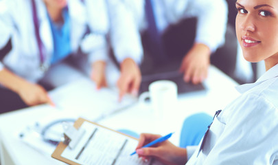 Happy medical team discussing and working together