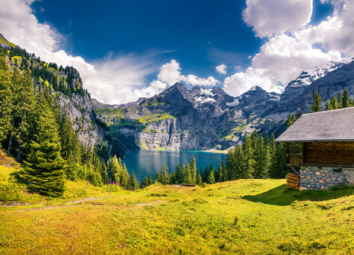 Colorful summer morning on the unique Oeschinensee Lake.