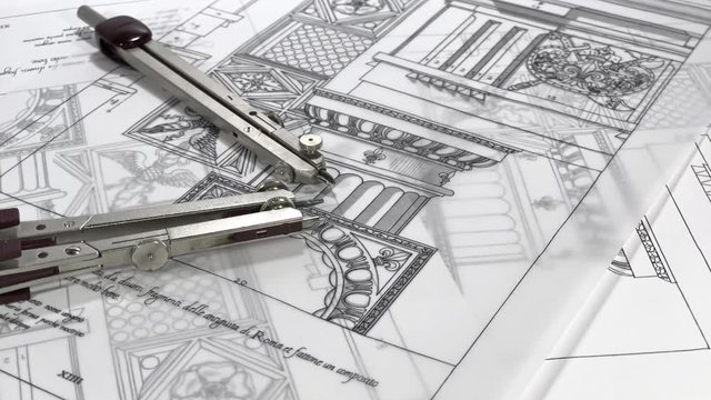 Workplace Architect: professinoalny tools - compasses rotate slowly in the drawings of elements of ancient architecture	