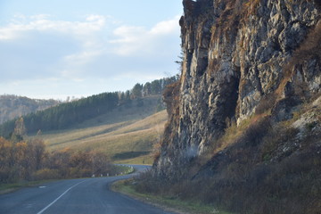  The road is along a steep cliff. Mountain Altai. Russia.