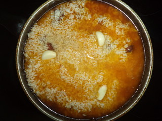 fried meat covered with rice and filled with water