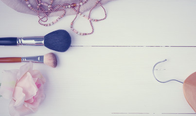 Woman clothing and accessories placed on a wooden background