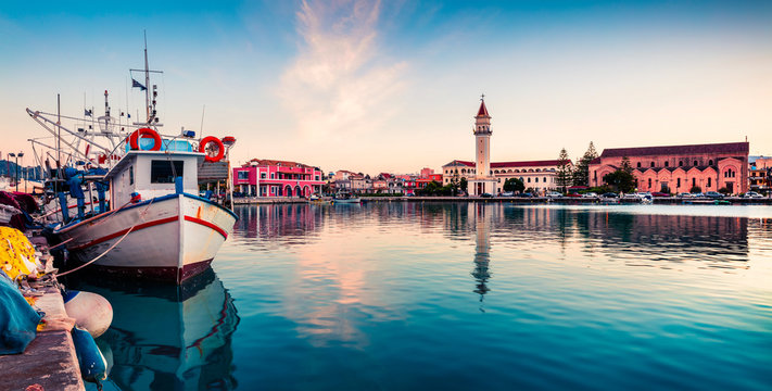 Picturesque spring sunset in the Zakynthos city. Great evening view of the town hall and Saint Dionysios Church, Ionian Sea, Zakynthos island, Greece, Europe. Traveling concept background.