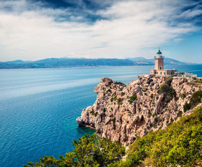 Bright sunny view of Melagavi lighthouse in the Corinth Gulf. Picturesque spring seascape in the Greece, Europe. Beauty of nature concept background. Artistic style post processed photo.