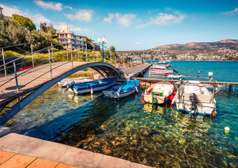 Colorful spring scene of the Porto Rafti port. Sunny morning seascape of Aegean sea, Greece. Traveling concept background.
